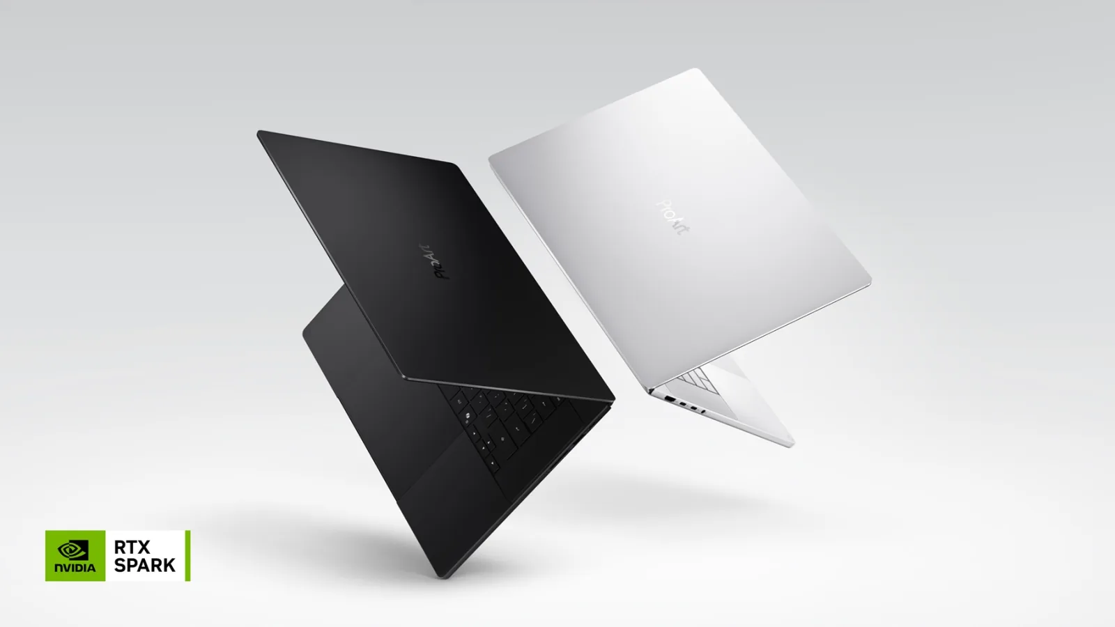 Hai laptop ASUS ProArt dùng RTX Spark màu đen và trắng